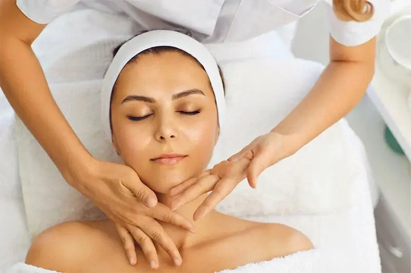 Woman receiving a gentle facial treatment